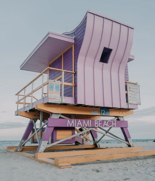 A purple lifeguard tower sits on Miami beach.